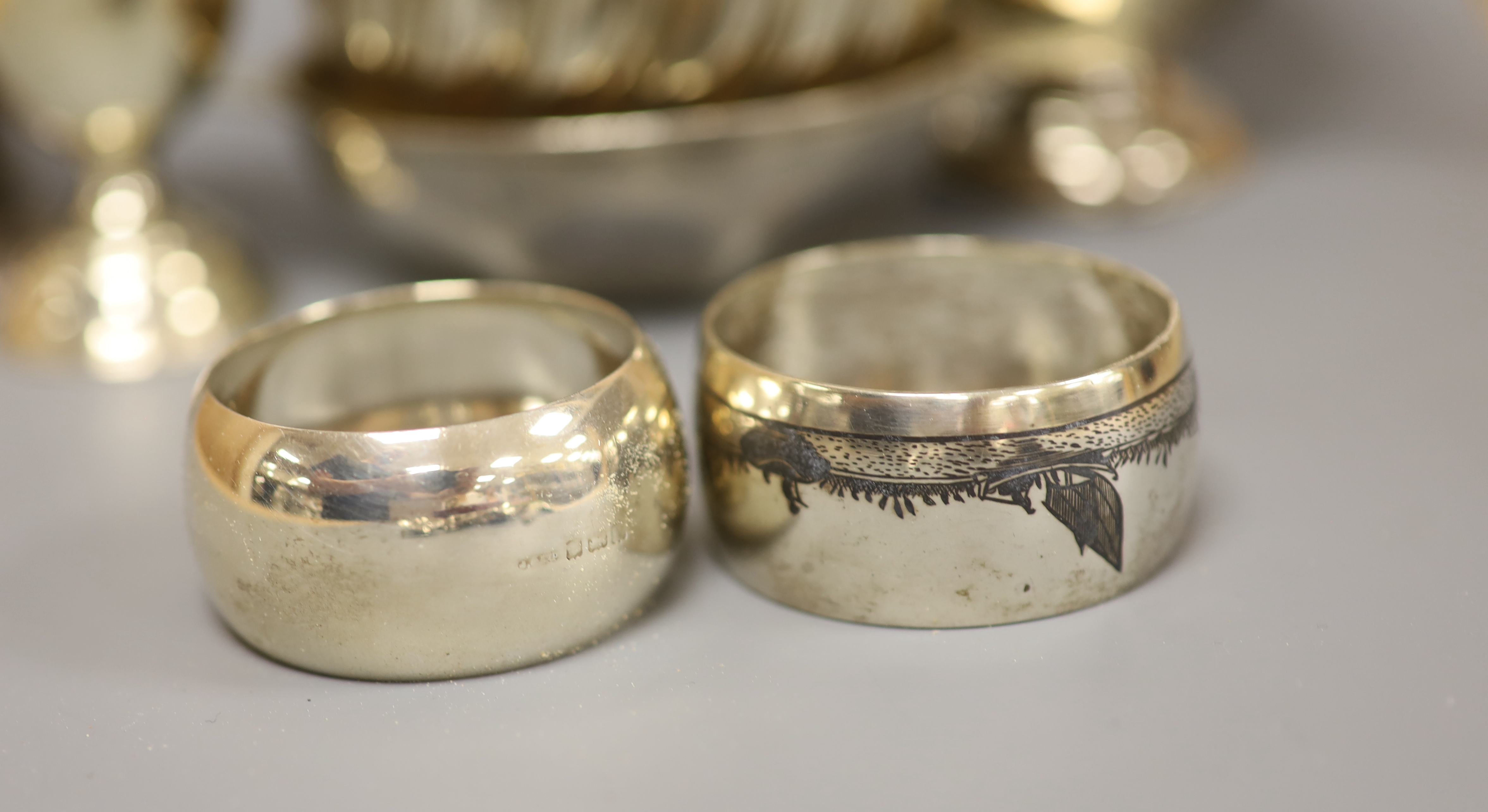A Victorian silver half-fluted cylindrical vase, a small pedestal cup, a quaich, a Prince of Wales caddy spoon and other silver items